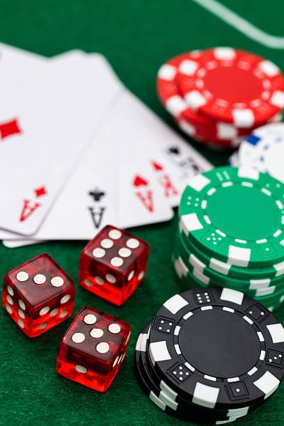 Live casino dealer at blackjack table, players' view
